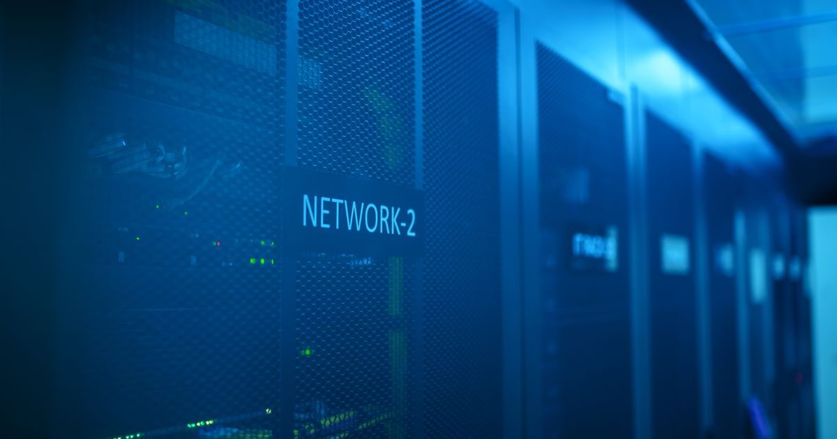 A modern server room featuring network equipment with blue illumination. Ideal for technology themes.